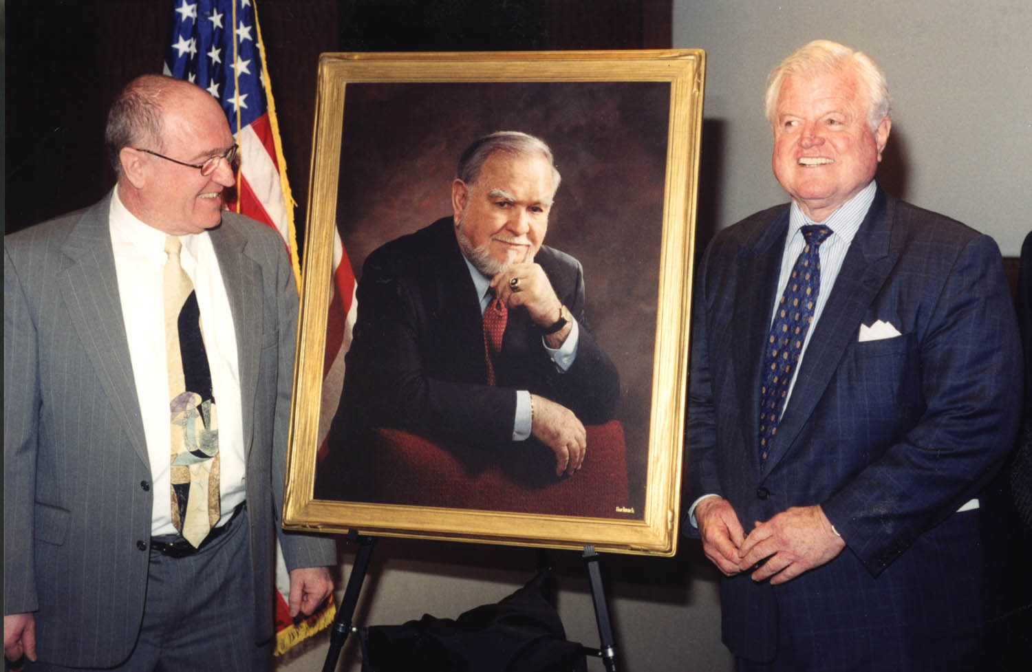 Ted Kennedy presenting Eli a portrait of Joseph Moakley and the position of Scholar in Aging Eye Research