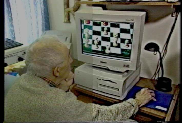 AMD patient Bernie Resnick plays chess against the computer using magnification software in Hope In Sight. The right half of the image is contrast enhanced to illustrate the effect.  The video was produced contrast enhanced on both halves.